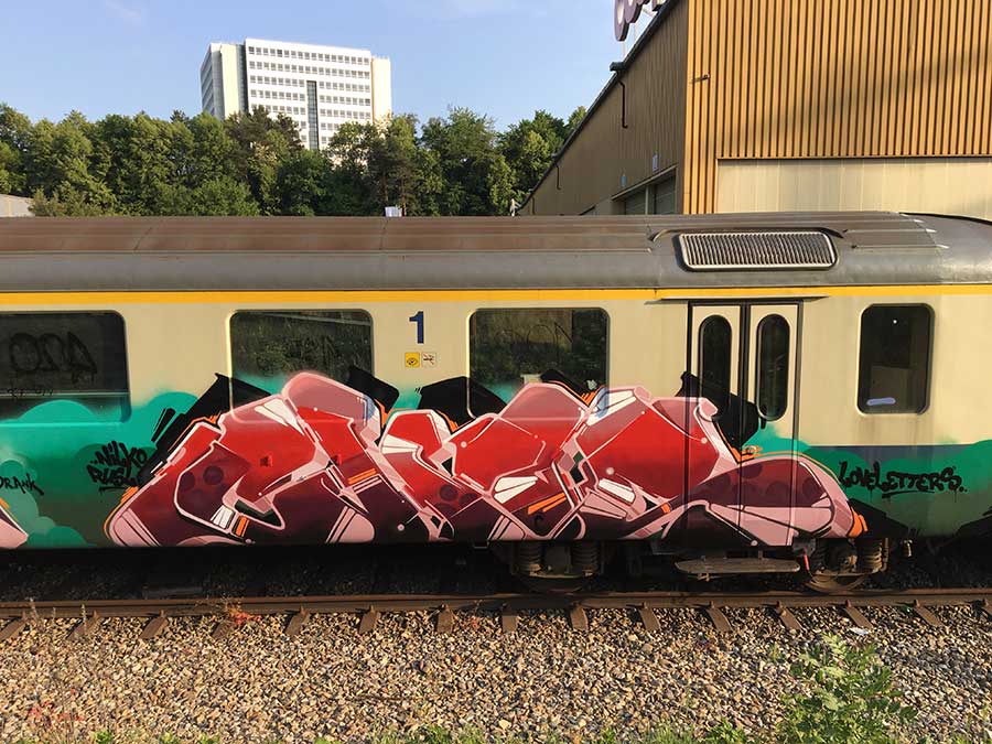 Red Graffiti Piece on Yellow train