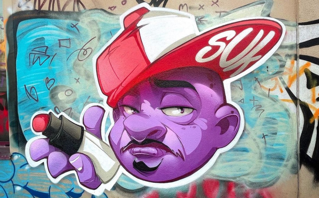 hombre graffiti artist mural